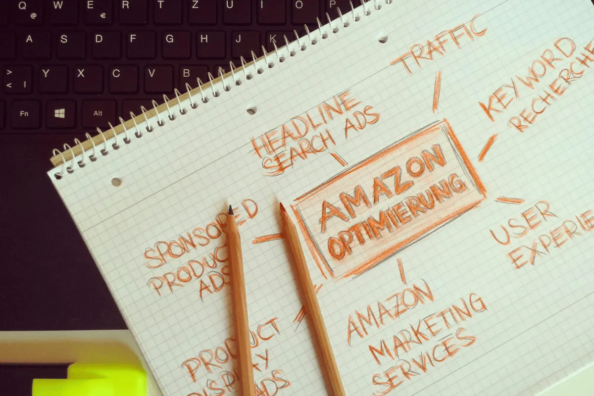 Notebook displaying a hand-drawn SEO plan for Amazon optimization, emphasizing user experience and traffic.